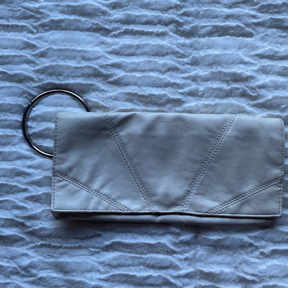 White/cream clutch cute for going out, put your hand through the ring for ease